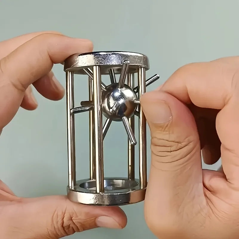 Steel cage brain teaser puzzle with cross bars and a spinning ball center