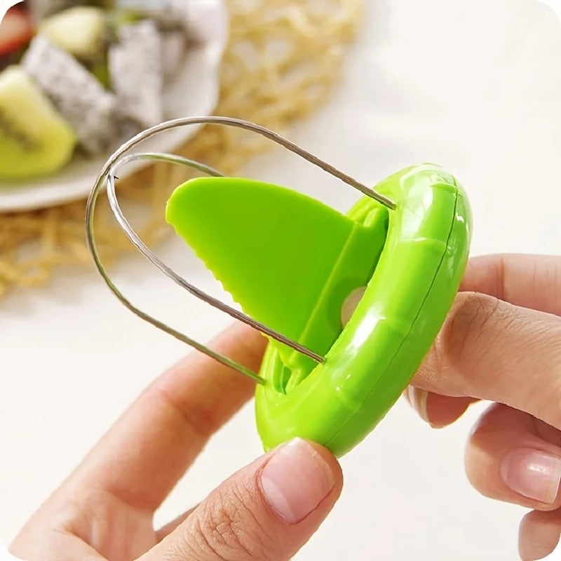 Green peel-and-split kiwi opener tool with curved wire prongs held in hands