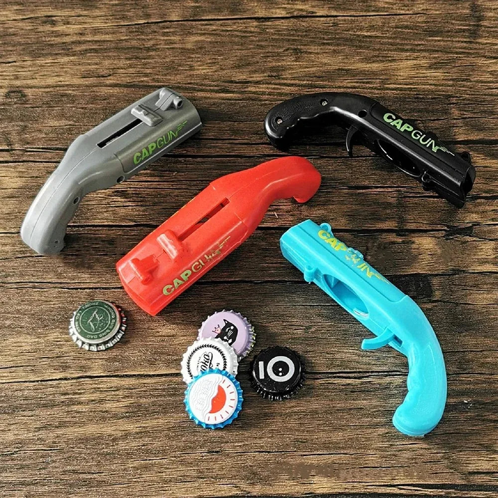 Assorted color plastic cap gun bottle openers (gray, black, orange, blue)