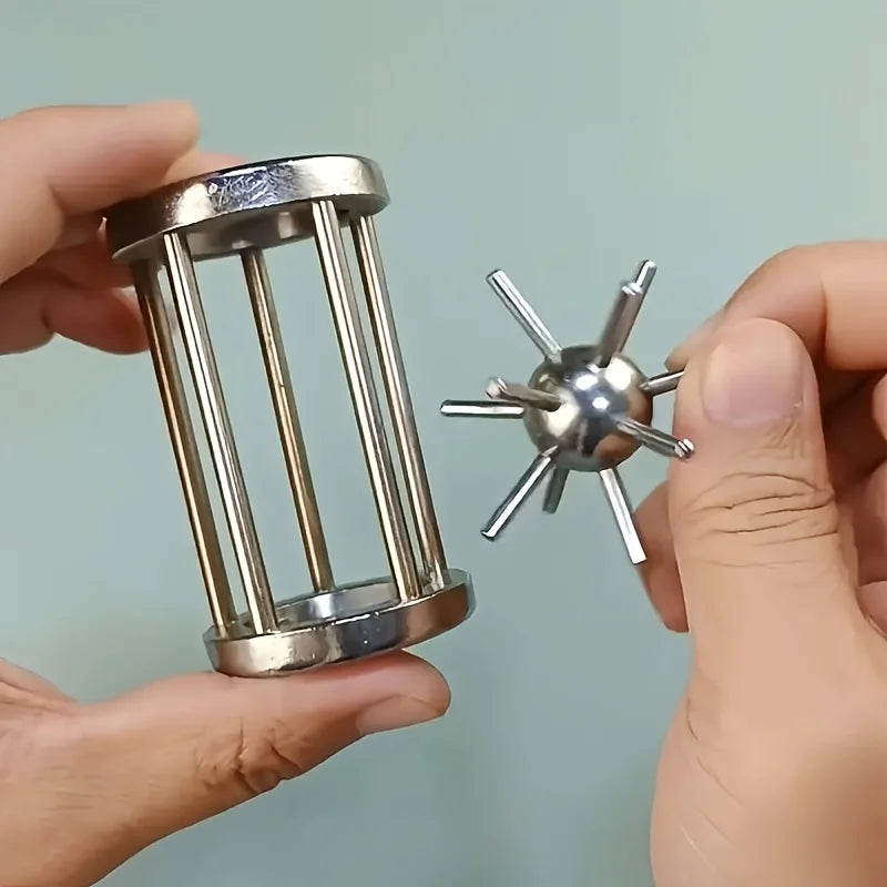 Steel cylinder puzzle with radial spikes and shiny ball-and-rod spinner
