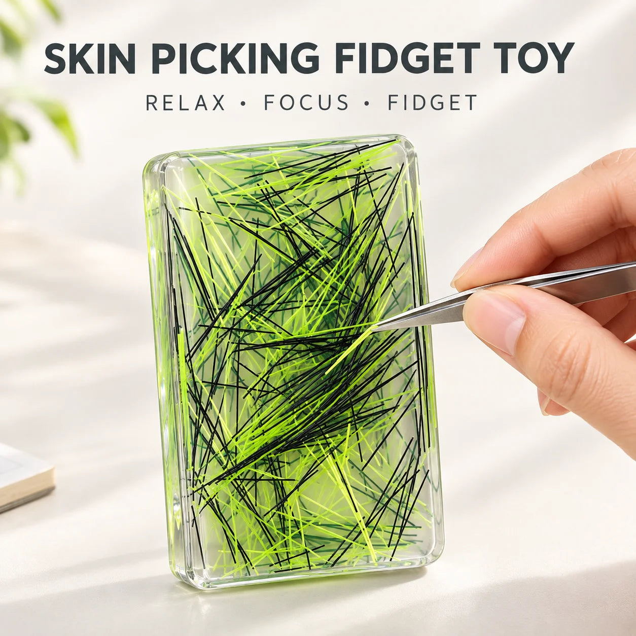 Neon green sensory fidget pad with tweezer tool in a clear case.